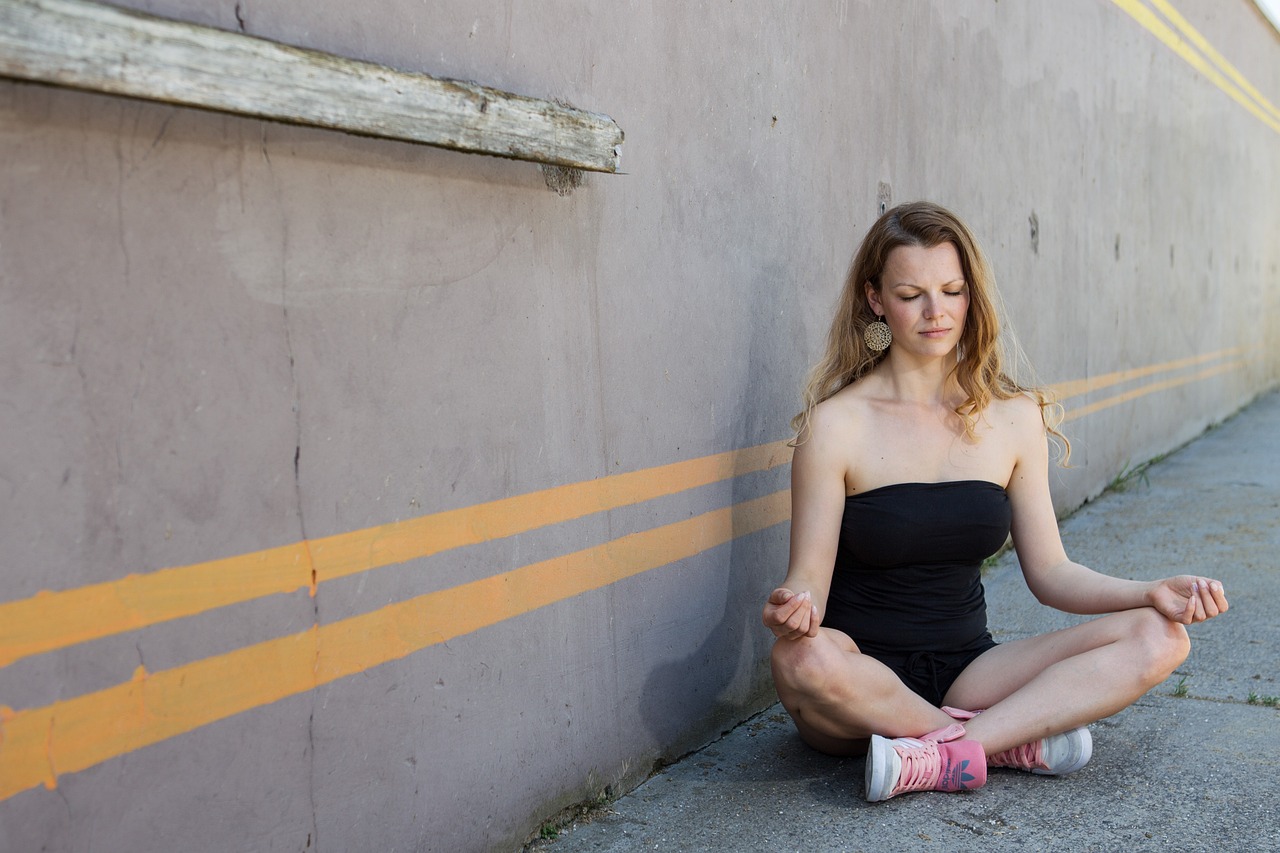 cta-02 meditation, yoga, woman, blond, person, nature, female, cross legged, urban, strip, wall, closed eyes, relaxation, summer, pleasure